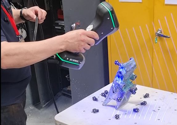 A former Formula One engineer uses a 3D scanner to capture the form data of a pharmaceutical component for reverse engineering.